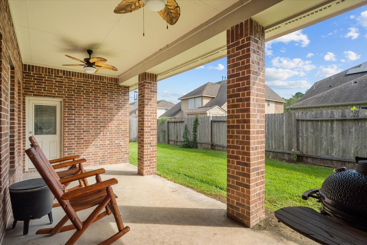 Covered back patio, perfect for morning coffee or unwinding in the evening. Covered back patio, perfect for morning coffee or unwinding in the evening.