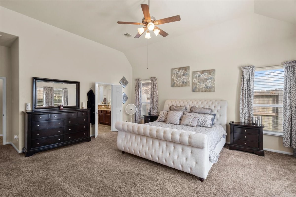 Relaxing primary suite with high ceilings and plenty of natural light. Relaxing primary suite with high ceilings and plenty of natural light.