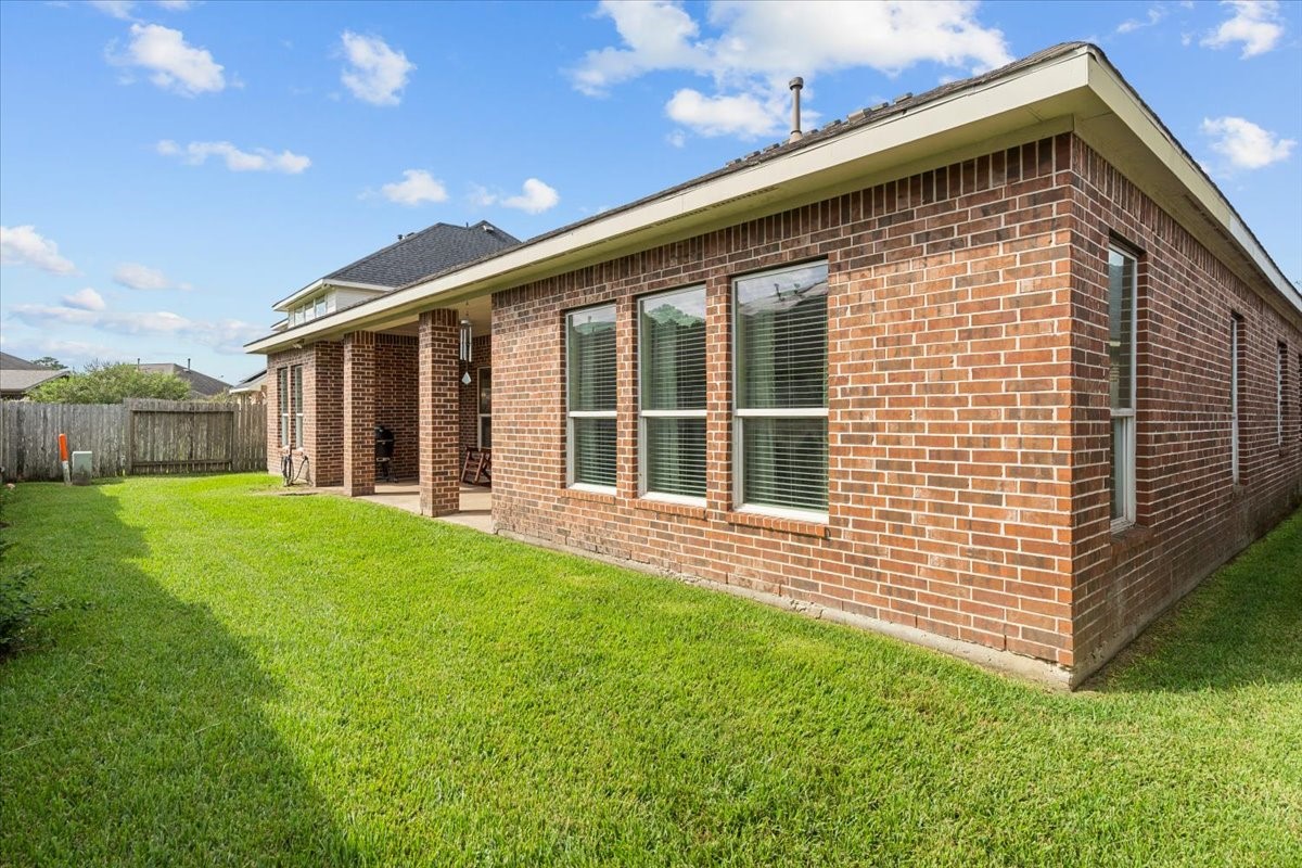 Grassy backyard with room to play, garden, or add your own touches.