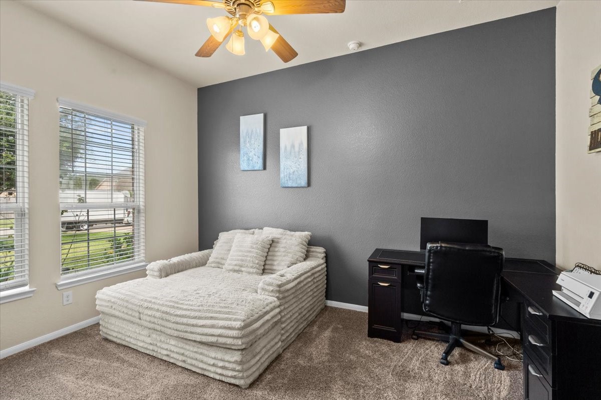 Flexible room with accent wall, great as a home office, playroom, or second living area.