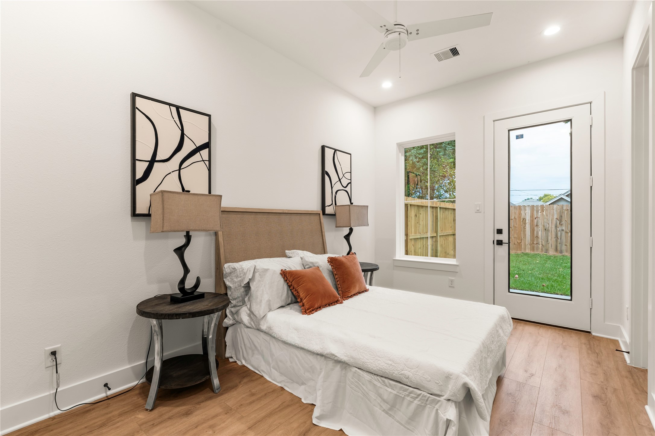Private first-floor guest suite featuring direct access to the fully fenced back patio.