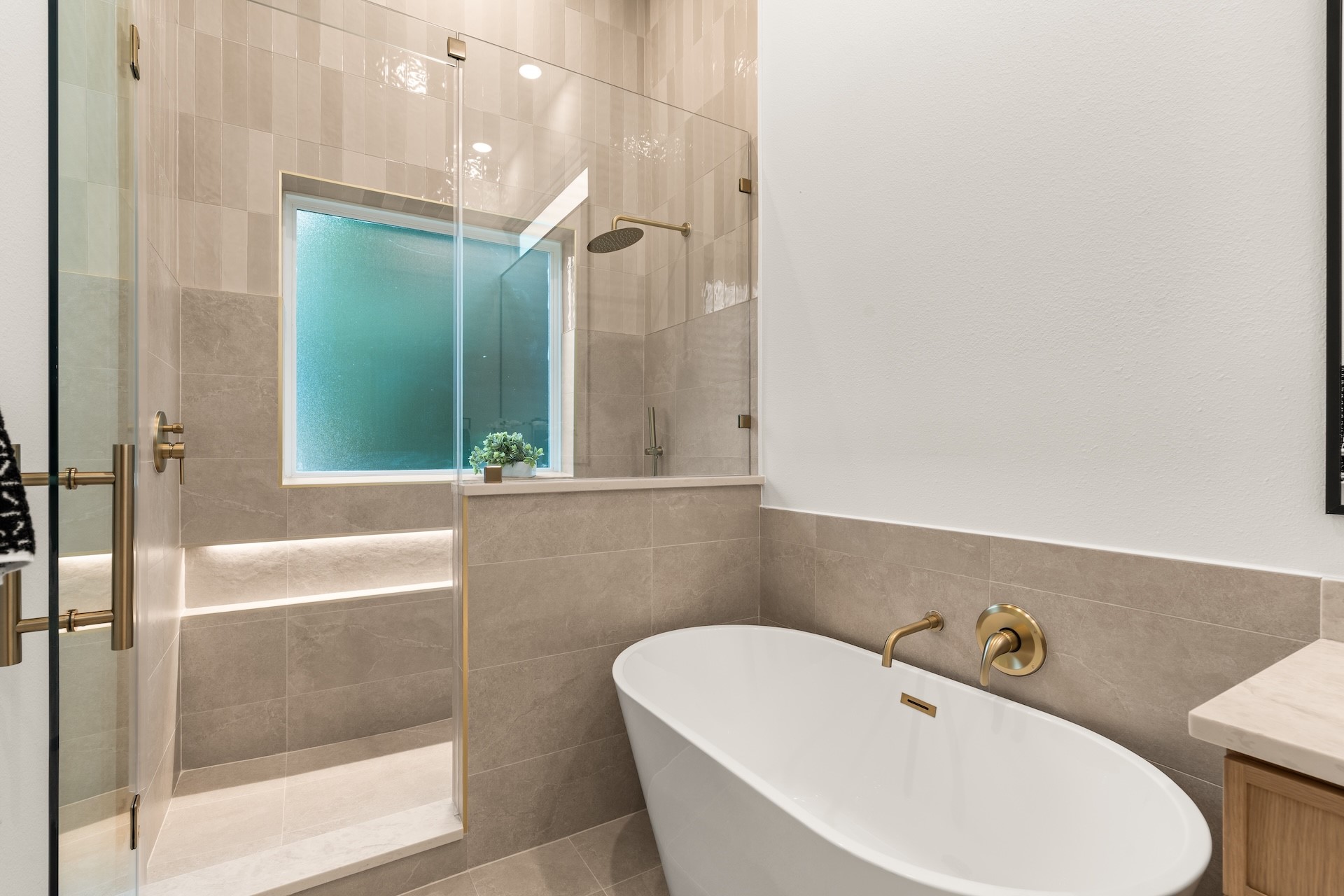Deluxe soaking tub paired with an adjacent glass walk-in shower for a daily spa experience.