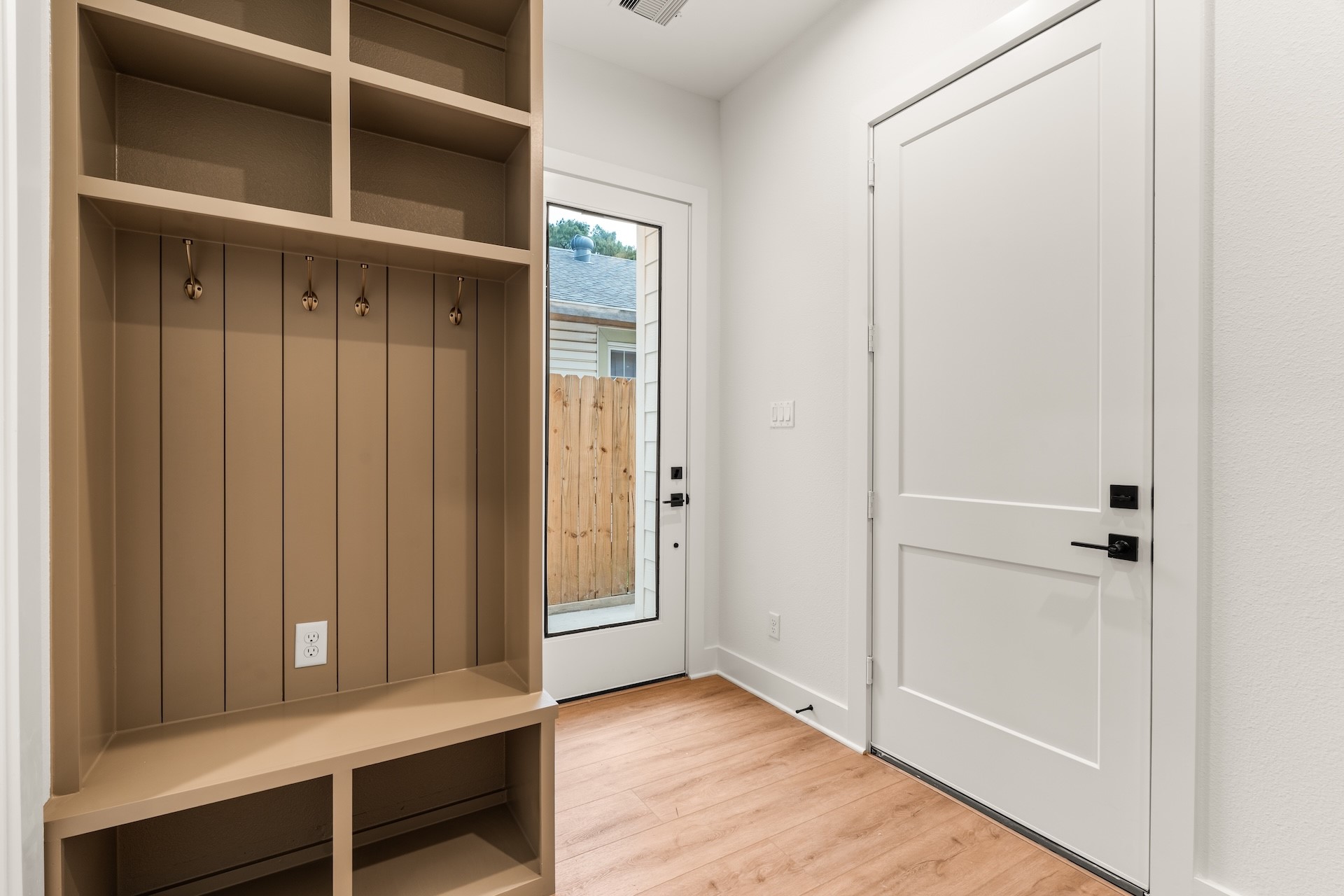 Functional first-floor entry complete with a built-in drop zone for shoes, coats, and daily essentials.