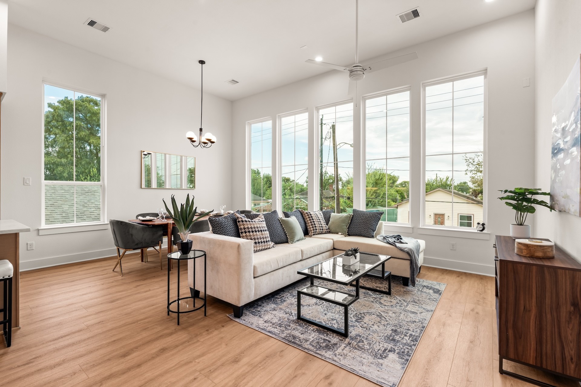 Soaring ceilings and floor-to-ceiling windows fill the main living area with warmth and natural light.