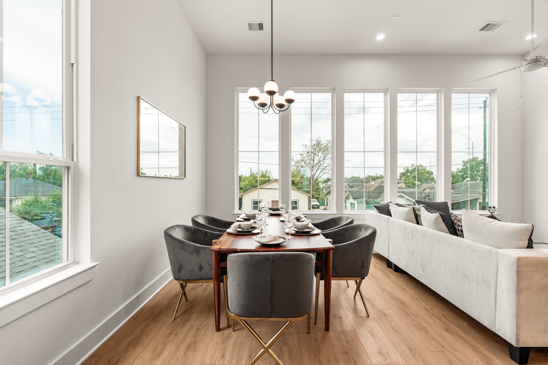 Dedicated dining space positioned alongside massive windows for bright, inviting family meals.