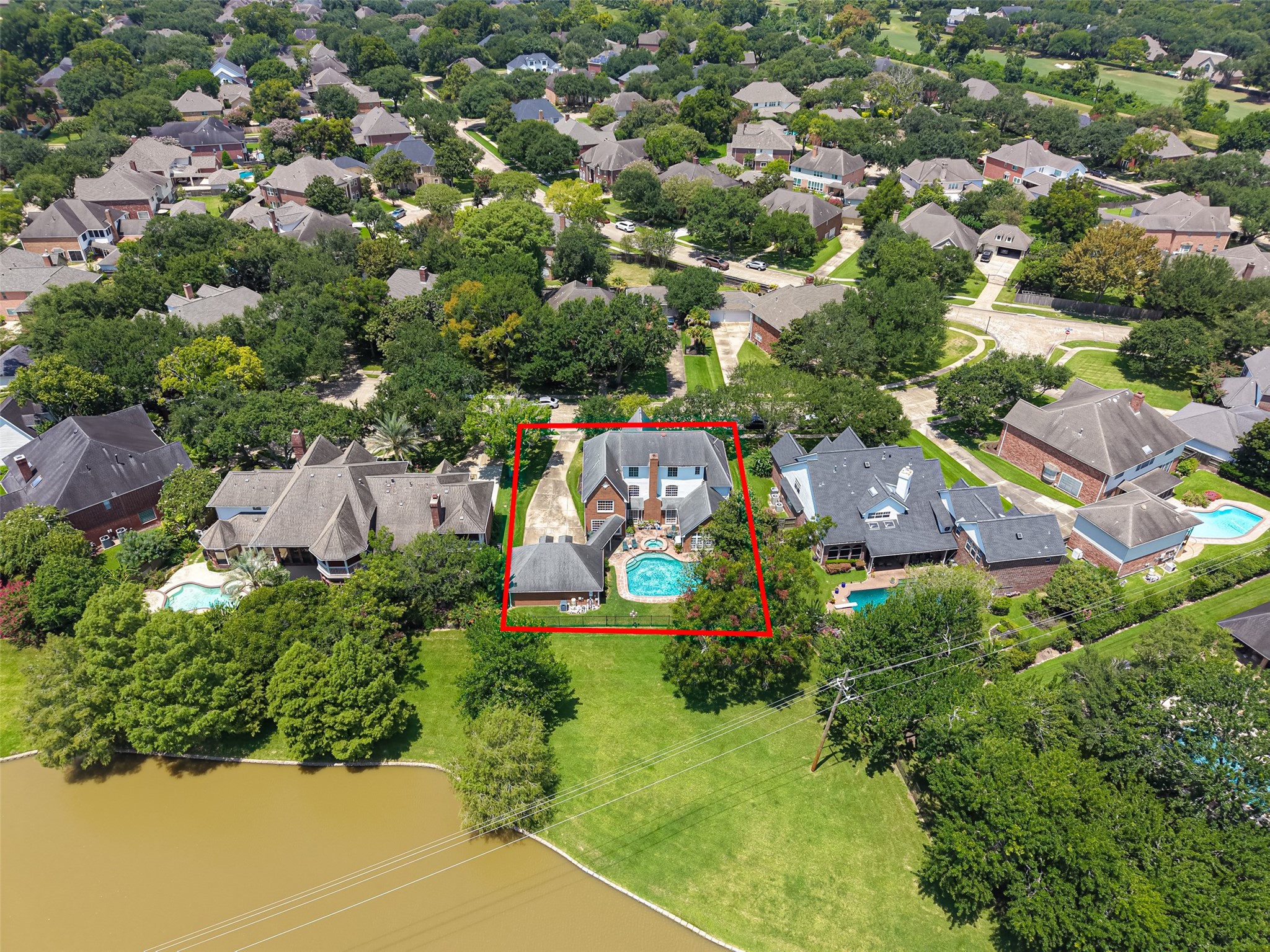 Nestled in a lush, tree-lined neighborhood, this elegant home boasts a spacious backyard with a refreshing pool, perfect for relaxation and entertaining.