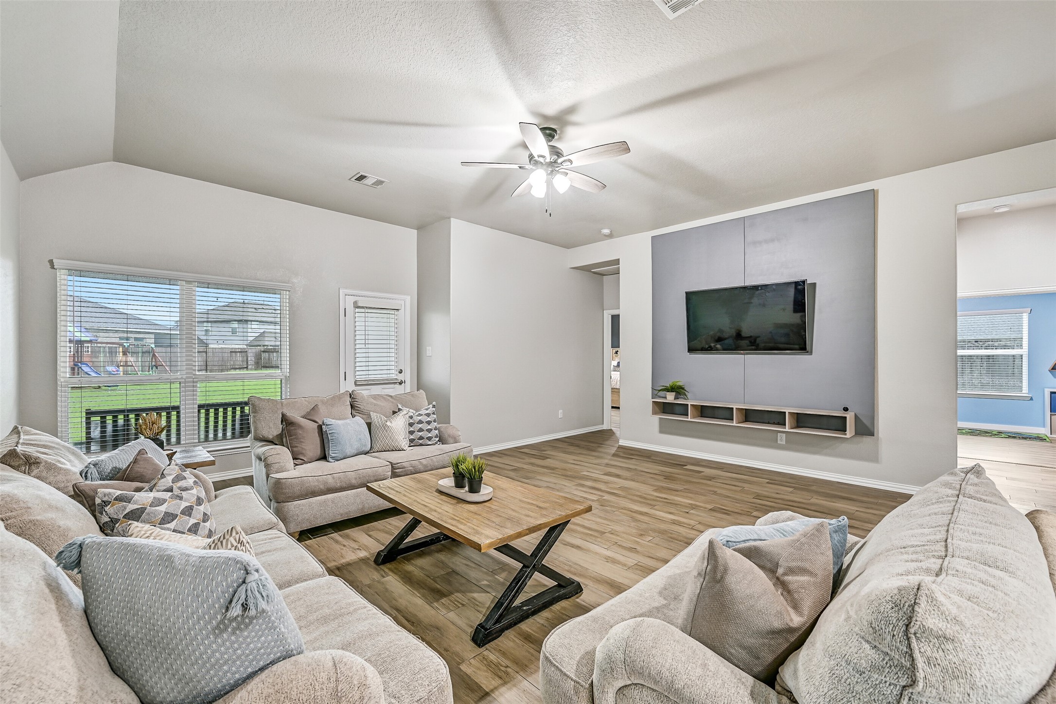 From this angle, you can truly appreciate the home's seamless flow from the entry through the dining room and into the kitchen and living spaces. The continuous flooring and neutral palette create a cohesive, move-in-ready interior.