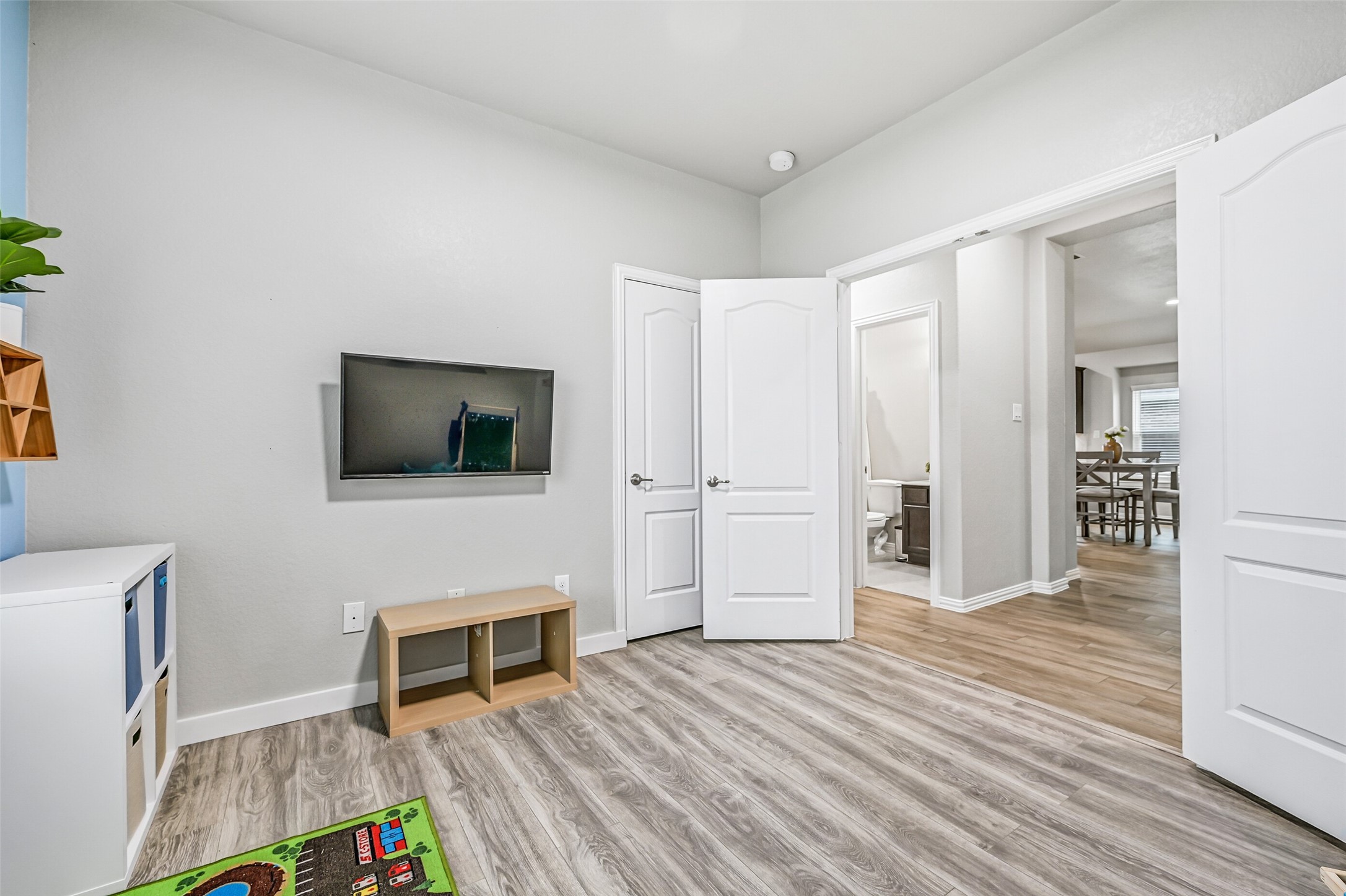 Located off the family room, this versatile flex room includes a closet, making it ideal as a fourth bedroom, home office, playroom, hobby room, or media space to fit your family's changing needs.