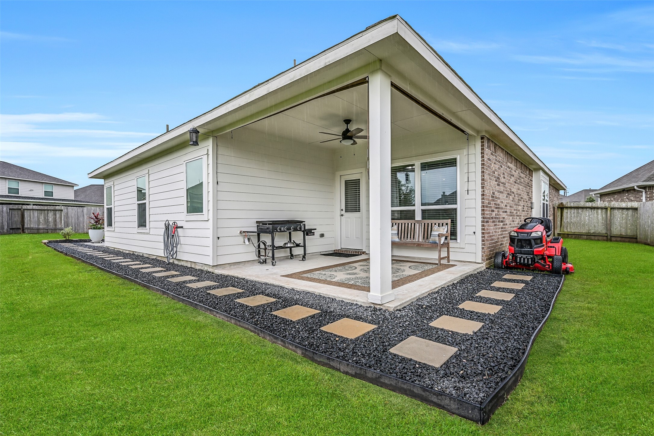 Step outside to discover a backyard that's truly hard to find in this price range. The covered patio is complemented by attractive landscaping, stepping stone walkways, gutters, and plenty of room for grilling, relaxing, and entertaining family and friends.