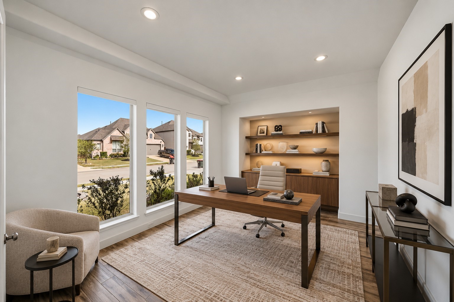Virtually Staged: Generously proportioned and naturally bright, this flexible space showcases elegant ceiling height and expansive exterior sightlines. Recessed illumination and built-in architectural recesses enhance the room's airy flow, setting the stage for focused work or relaxed living.
