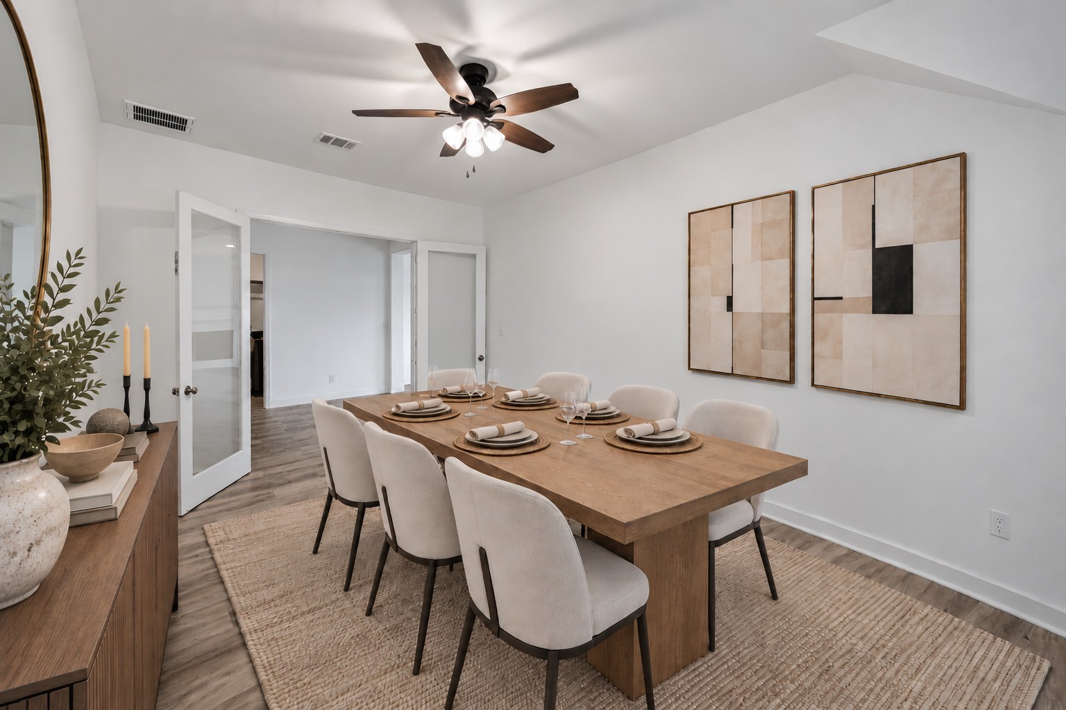 Virtually Staged: Overhead air circulation and generous wall spans give the room an open, breathable volume with smooth connectivity to the adjoining corridor.