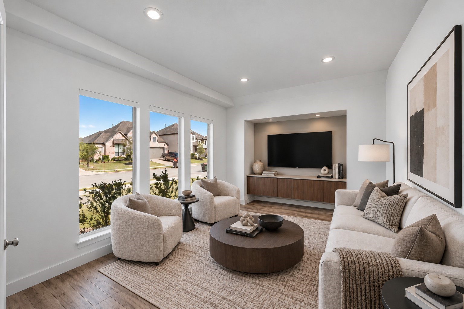 Virtually Staged: Generous proportions and continuous natural light from expansive vertical windows create a comfortable, seamless gathering space