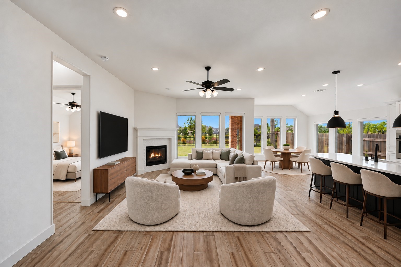 Virtually Staged: Substantial ceiling height and expansive wall-to-wall expanses define this luminous central space, anchored by an integrated fireplace.