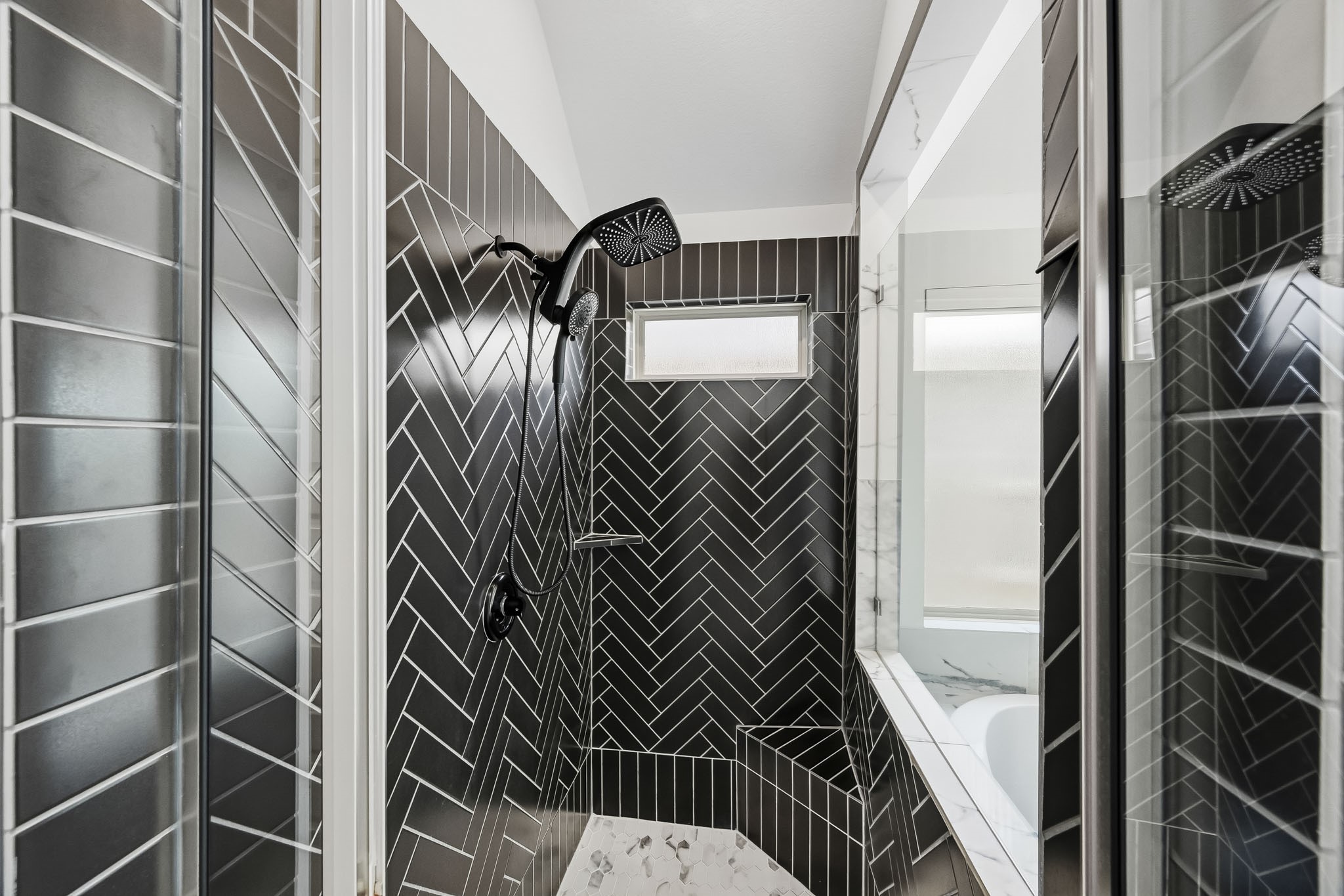 Designed with crisp vertical lines and clean architectural angles, this spacious shower enclosure maximizes functional volume.