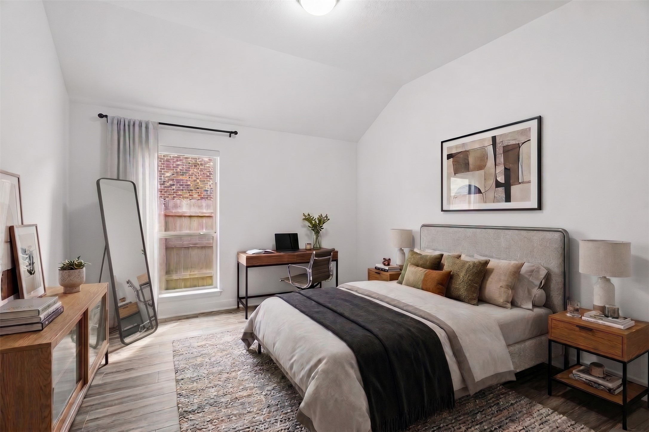 Virtually Staged: Featuring clean lines and expansive ceiling height, this secondary bedroom balances generous proportions with everyday functionality.