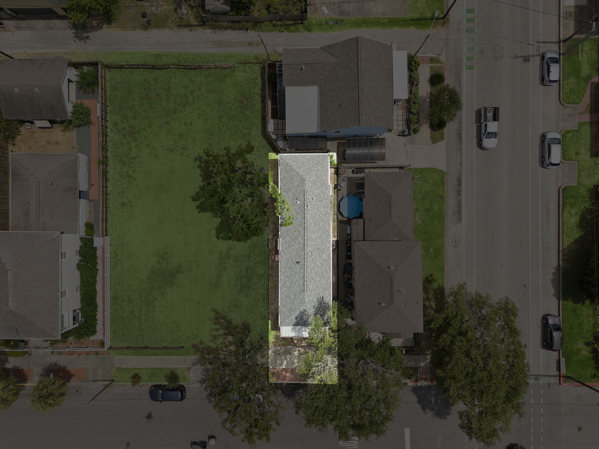 View of home and surrounding homes and lot.