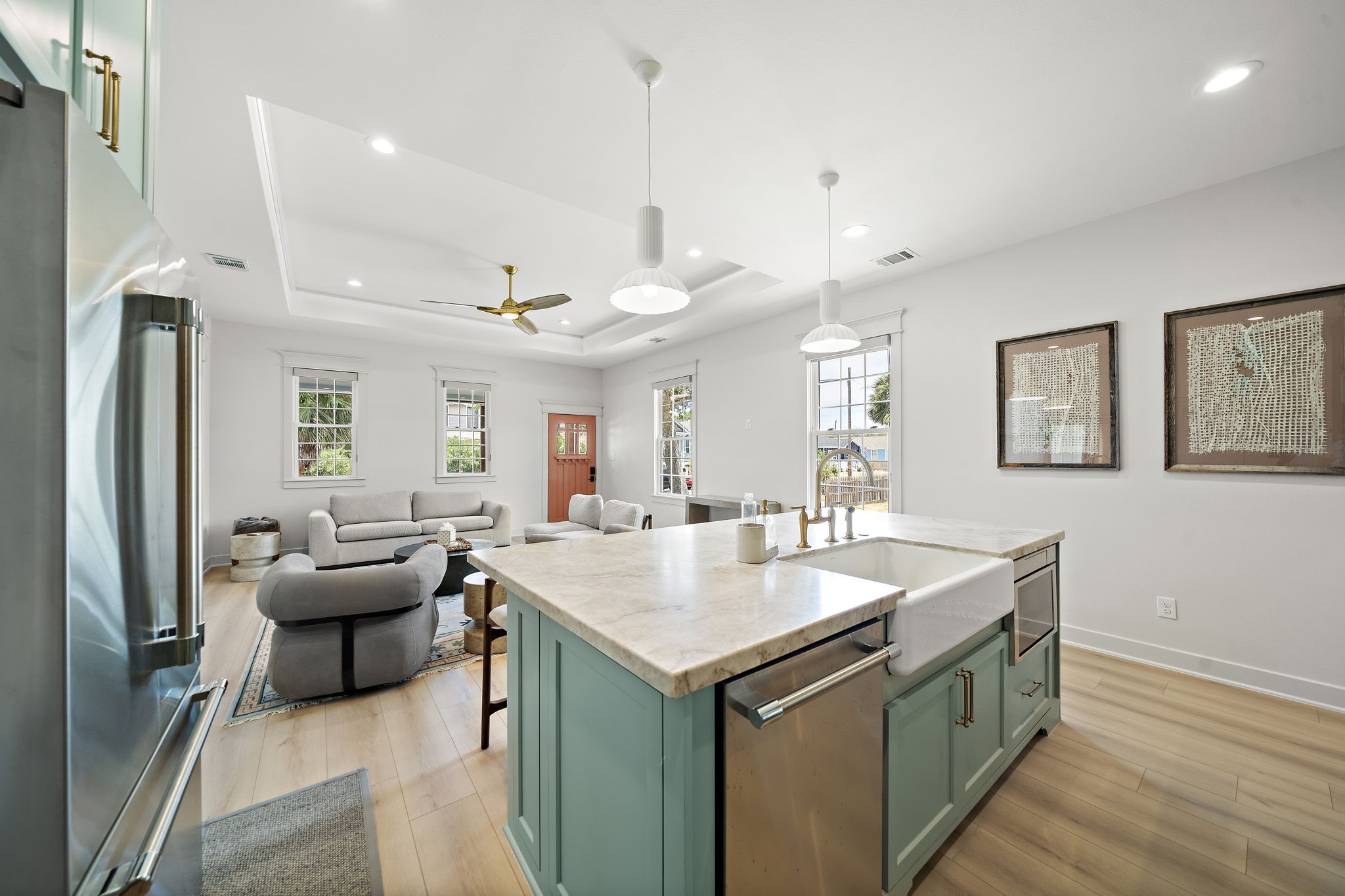 Kitchen island with dishwasher, microwave, Quartzite leathered countertop, extra storage and farmhouse sink.