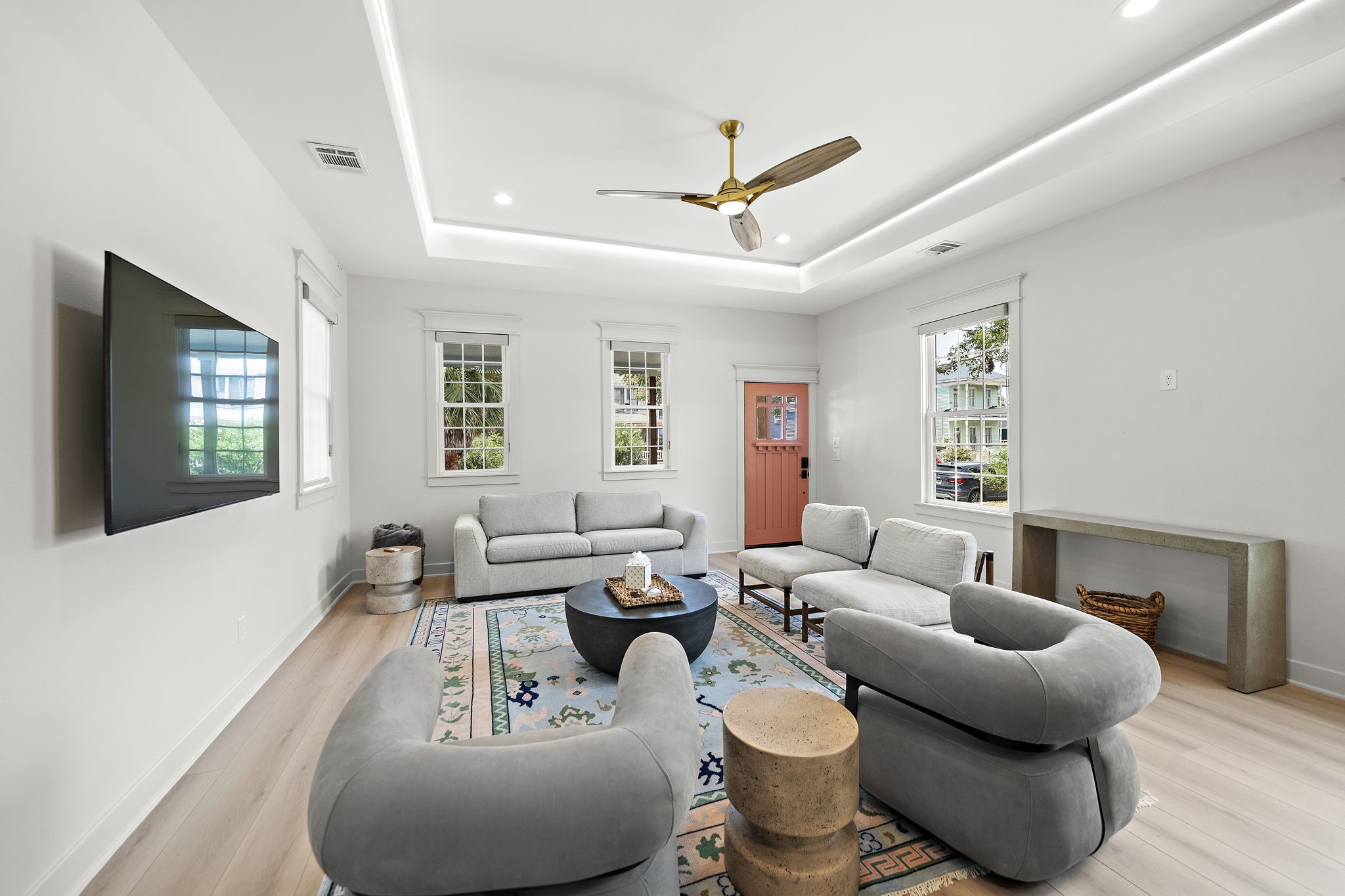 View of living room, front door, recessed rope lighting, and Four Hands furniture.