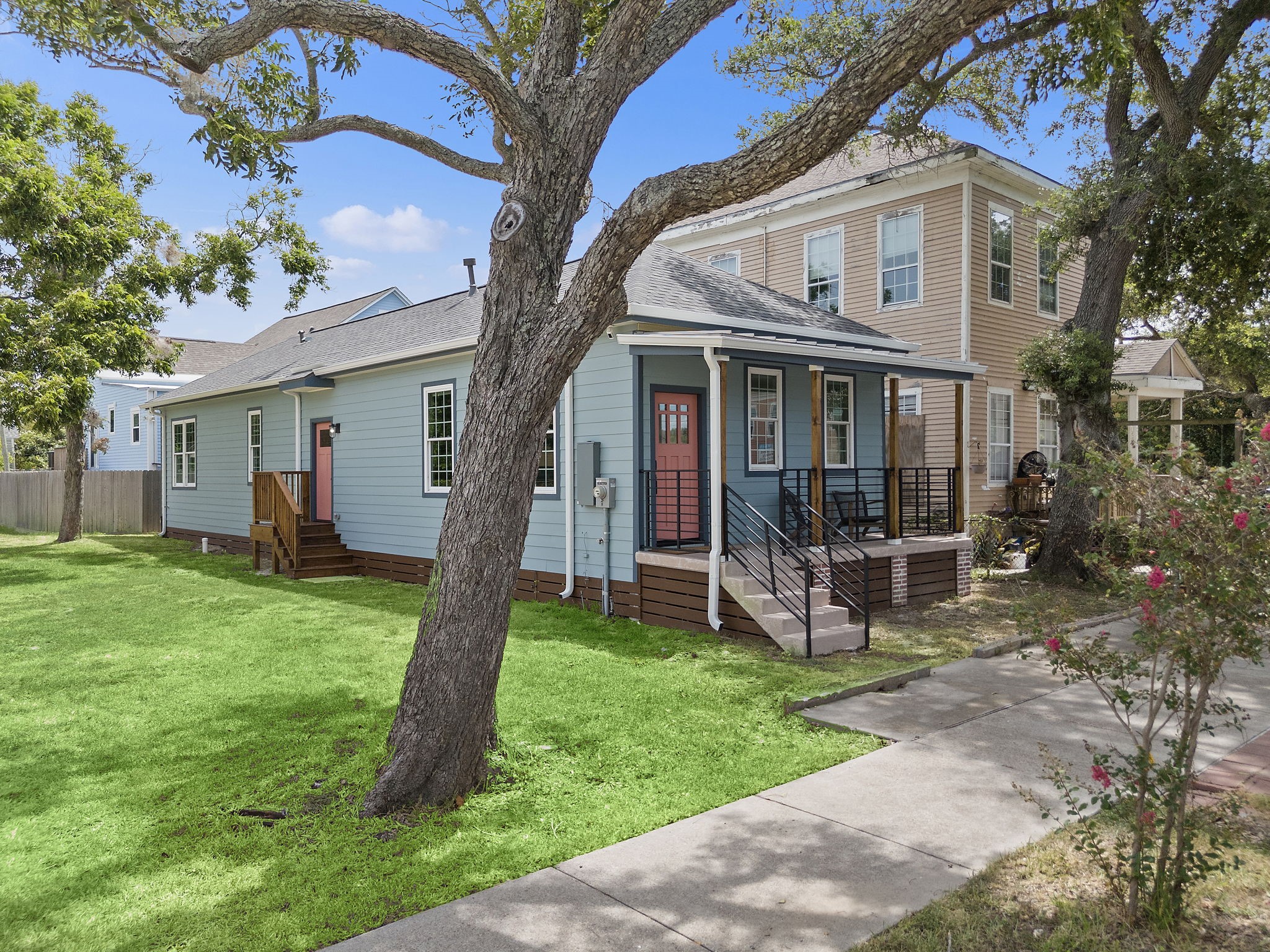 Side view of home - new fence, walkway, and pathed front lawn has been installed since this picture.
