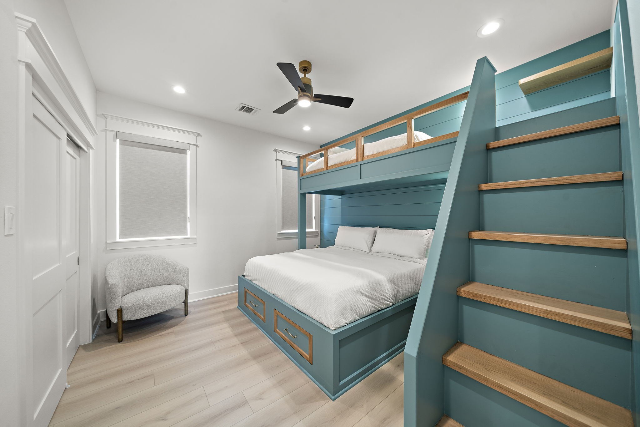 Another view of the secondary bedroom, and blackout custom blinds.