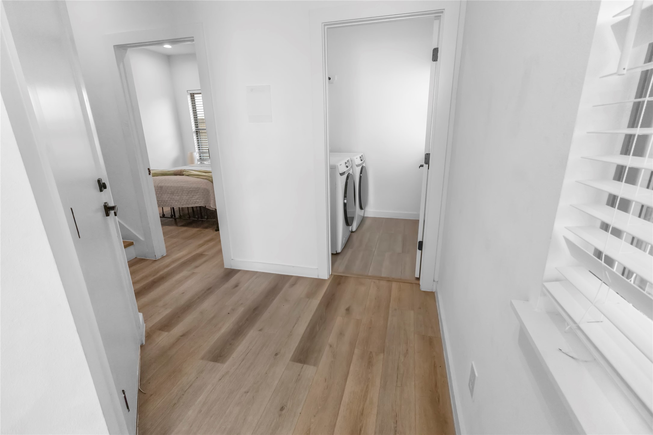Welcoming entry features clean architectural lines, contemporary finishes, and durable wood look flooring that immediately sets the tone for the homes modern aesthetic.
