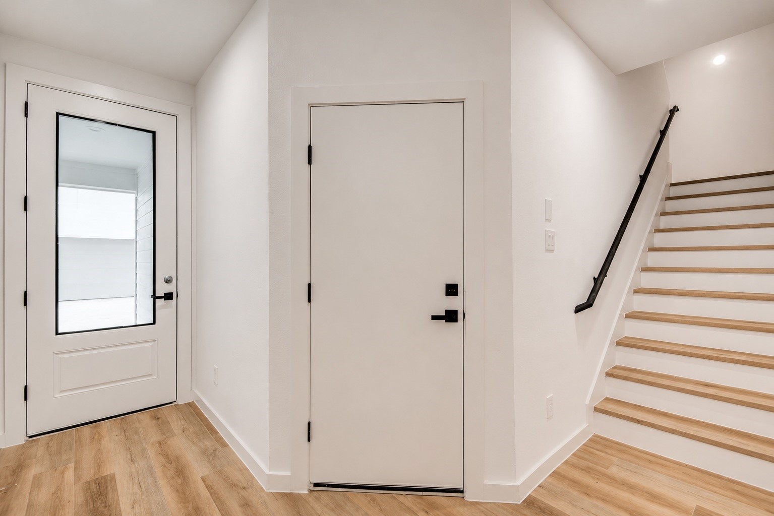 Direct garage access leading into the home and thoughtfully designed stair placement provides an easy transition to the open concept living spaces on the second floor.