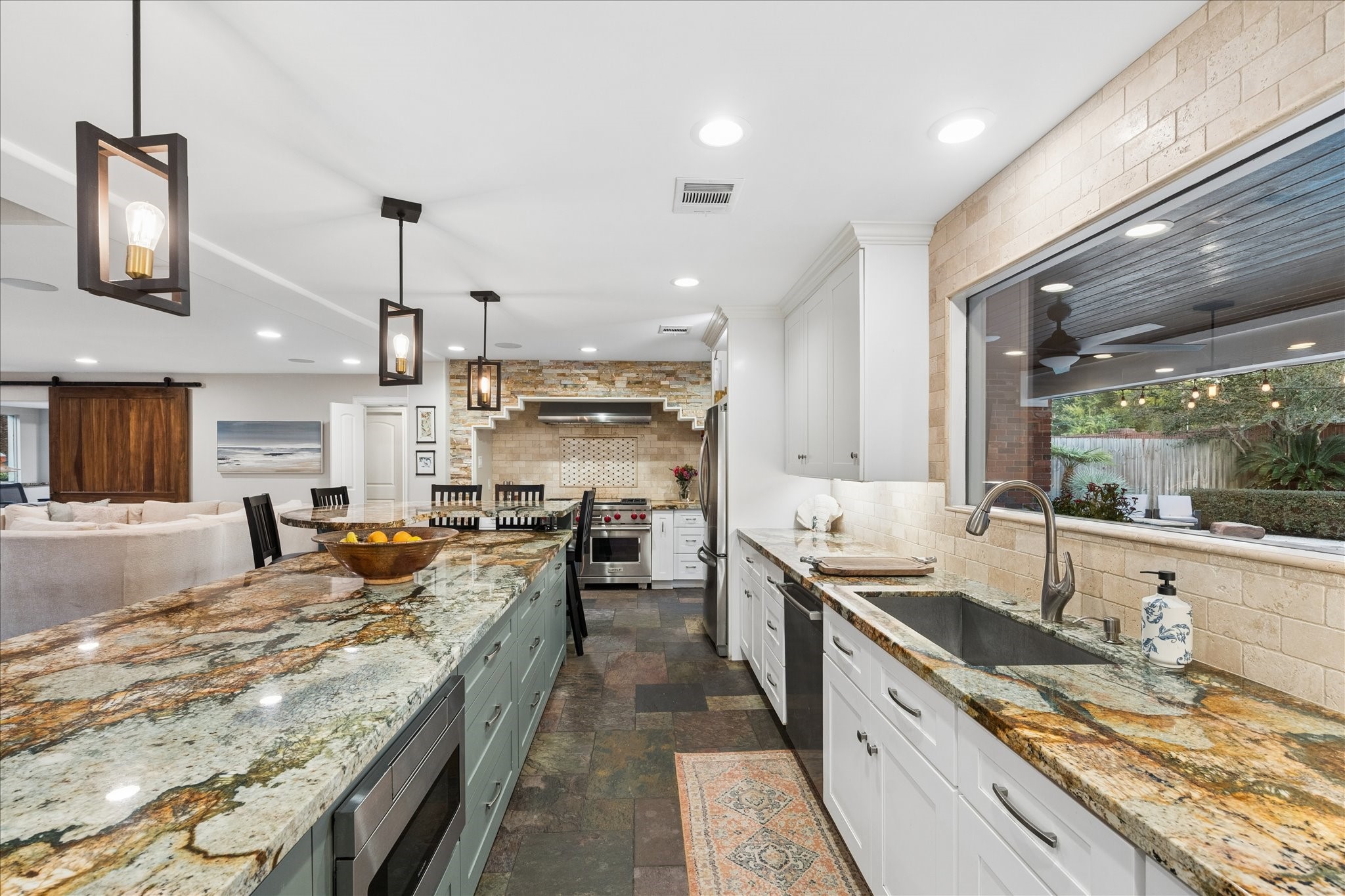 Natural light abounds throughout, the kitchen has views to the resort styled backyard.
