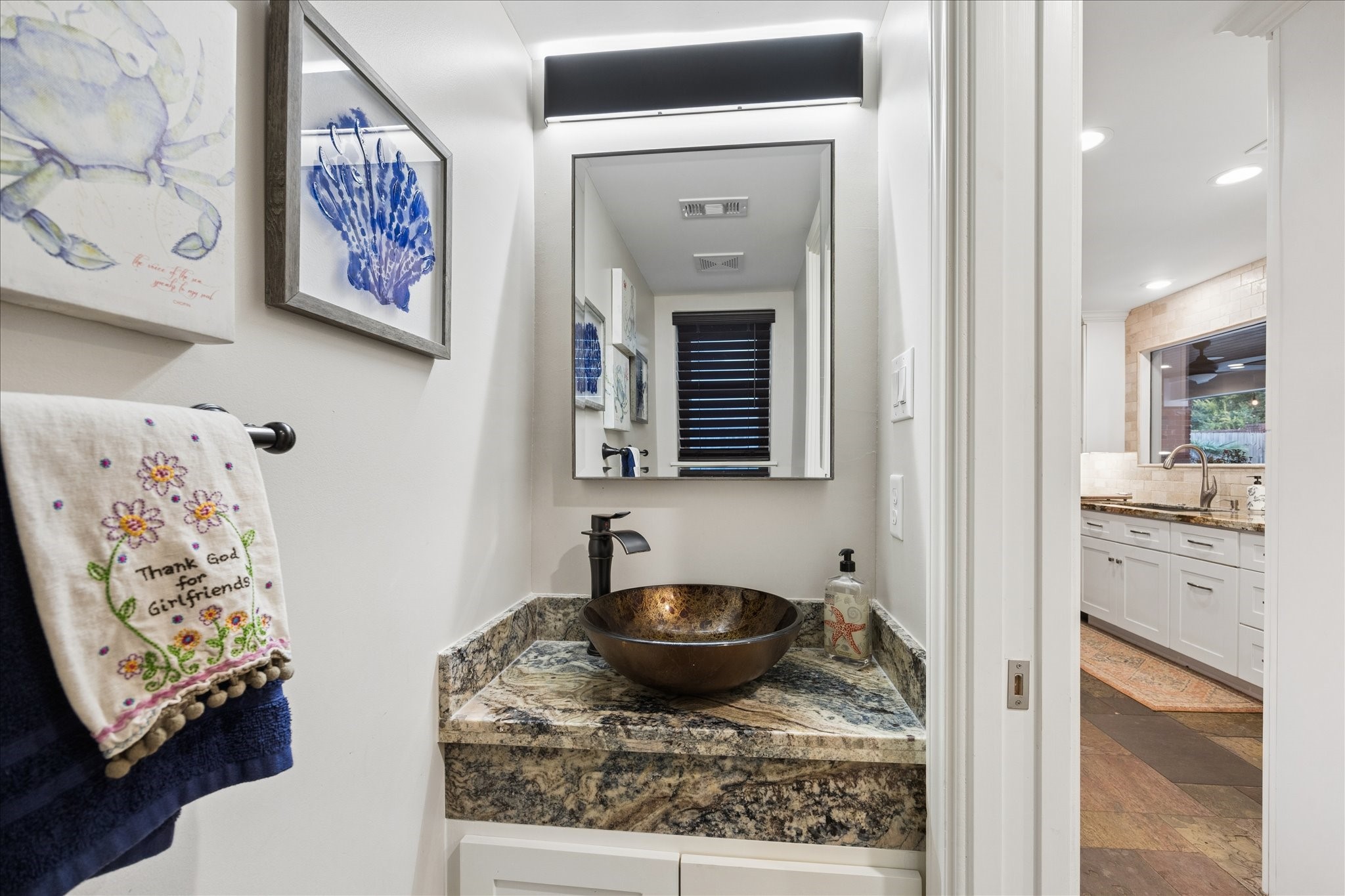 The powder room is conveniently located for easy access from the pool.