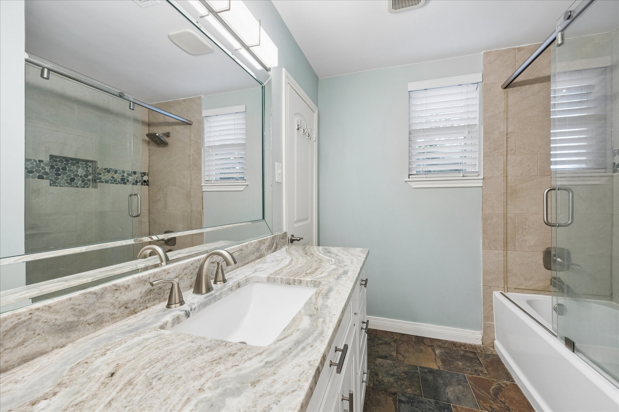 Great layout for guests with 2 large sink/vanity areas, separated by a door for privacy.