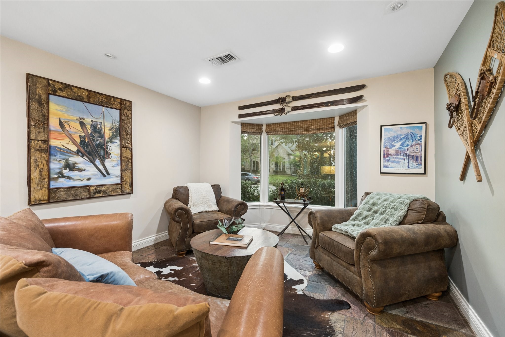 Currently a sitting/living room. This space is flexible and could make a great study.