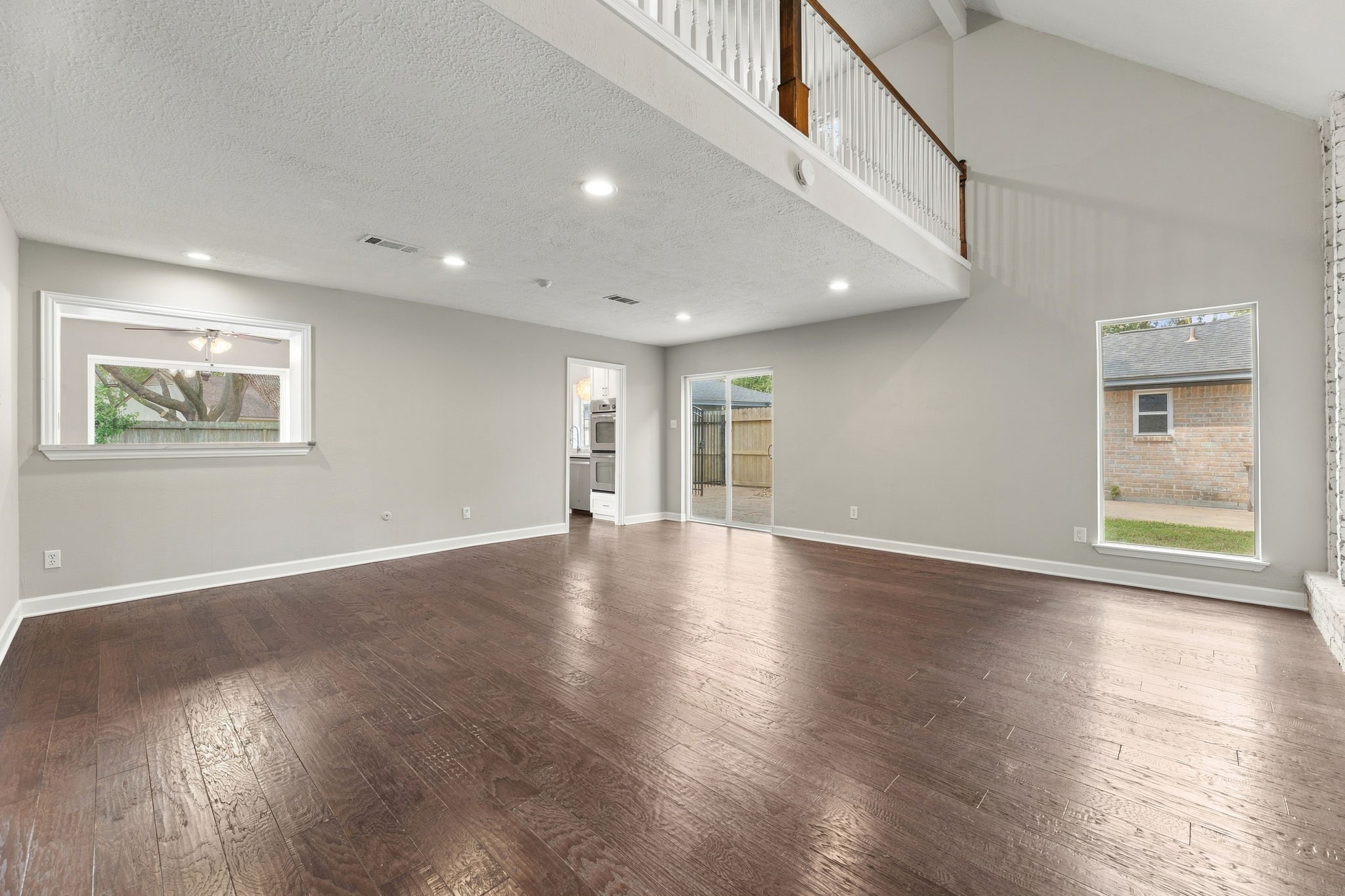 Spacious living area with soaring two-story ceilings!