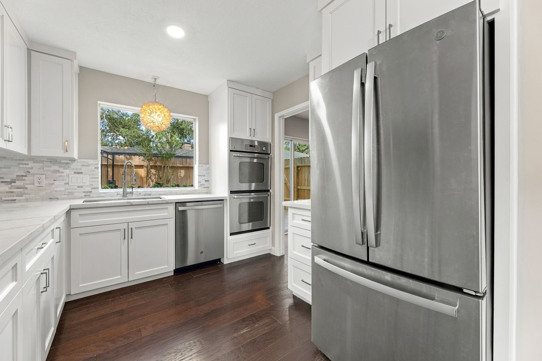 Updated kitchen with quartz countertops and stainless steel appliances!