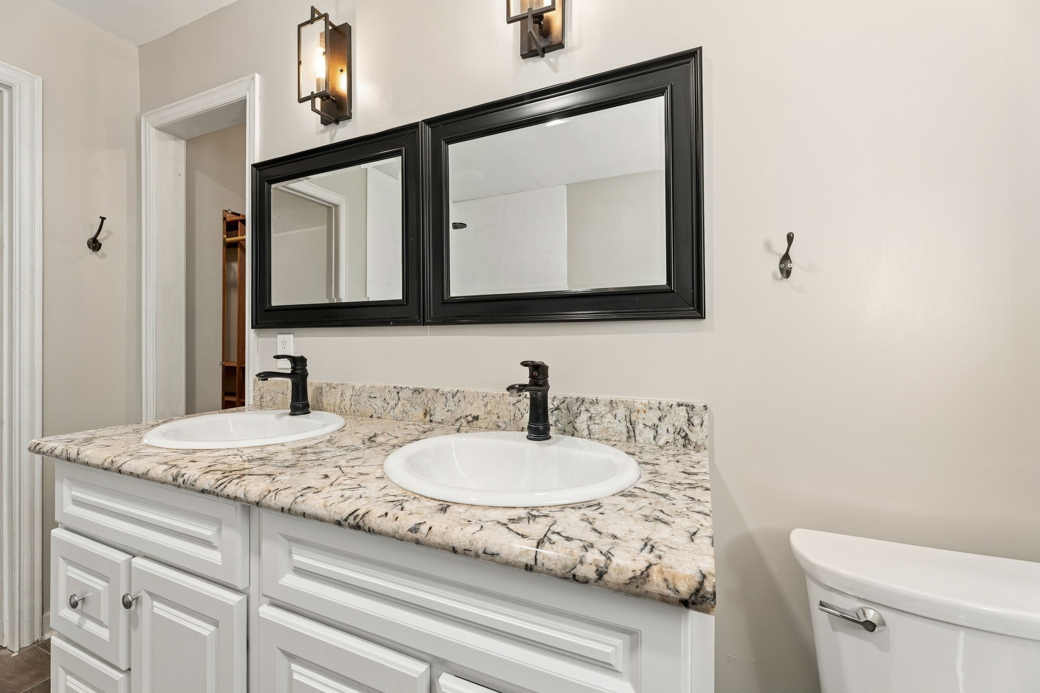 Updated primary bath with double vanity and walk-in shower!