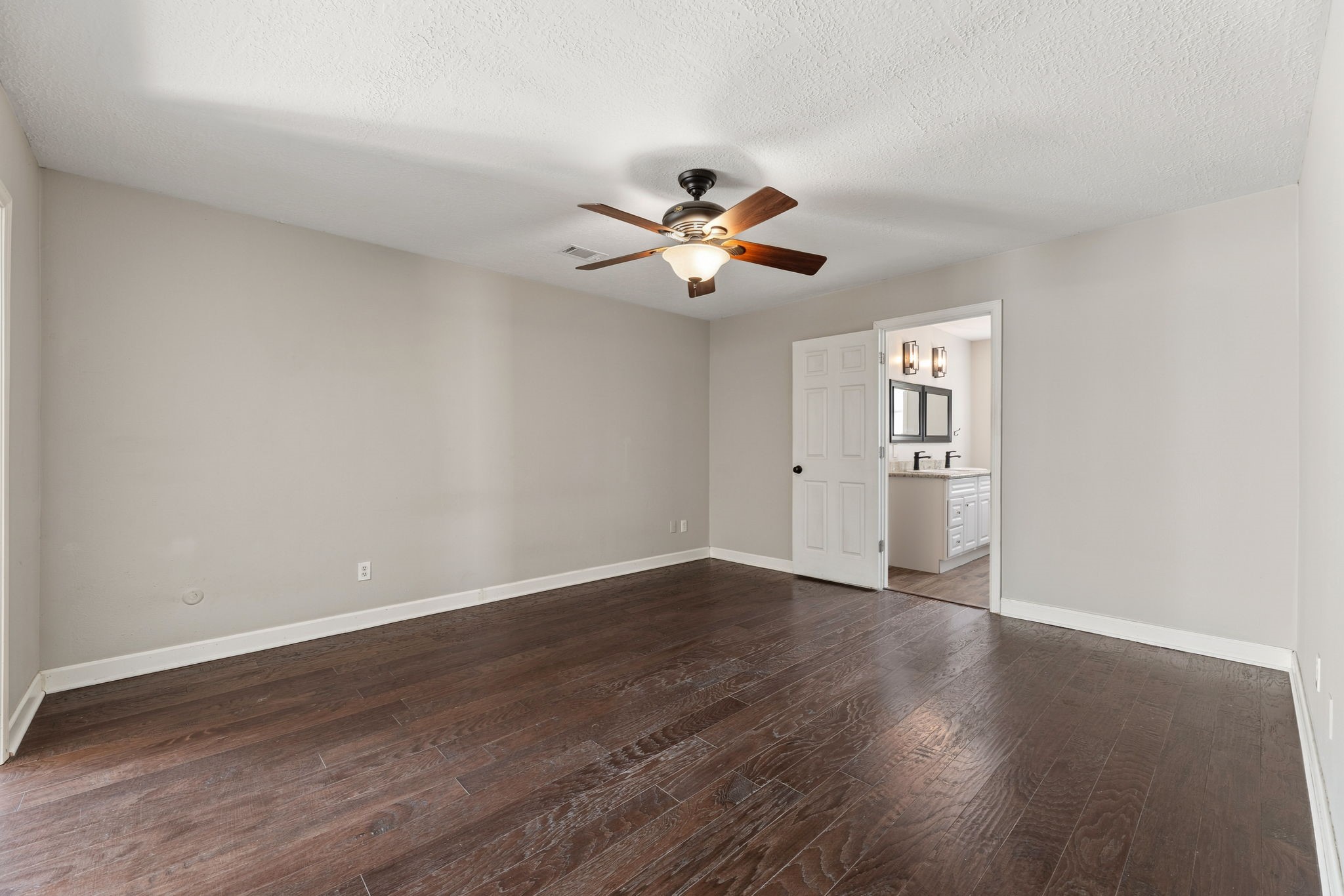 Generously sized primary suite with room to relax!
