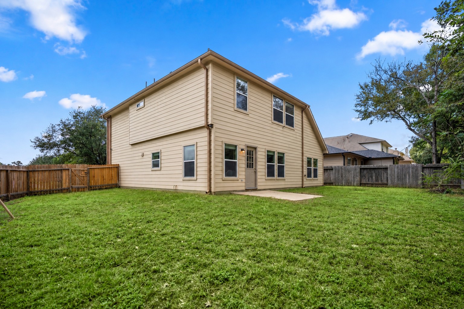The backyard continues around the side of the home, giving you even more usable outdoor space than you see from the patio alone. With no neighbor on this side, theres room for play, pets, gardening, or extending the outdoor setup while keeping that more open feel the lot offers.