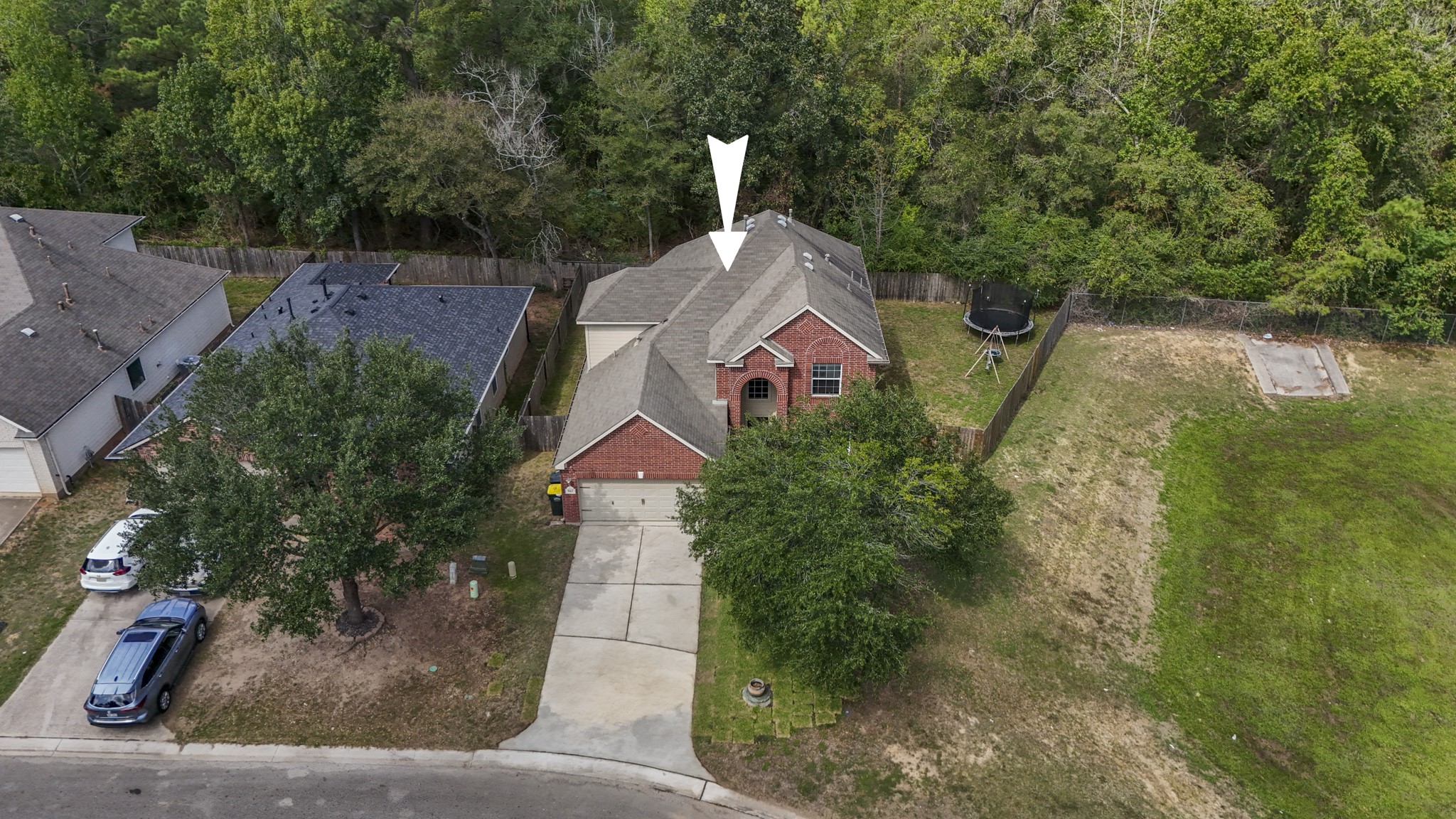 This aerial view really shows off the settingno back neighbors and no neighbor along the right side of the home, giving the backyard and side yard a more open, private feel. Its the kind of setup that gives you more room to enjoy the outdoors without feeling boxed in.