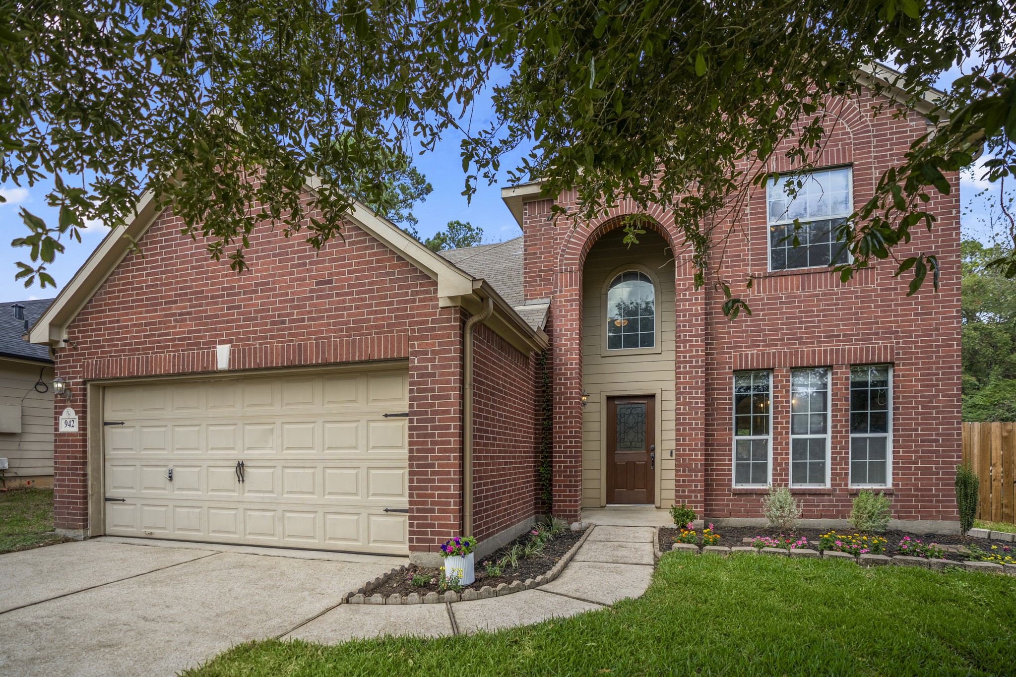 Welcome home to 942 Oak Glen Drive in Olde Oaks, where a brick exterior, mature trees, and a curved walkway create an inviting first impression. The attached two-car garage sits just off the drive, while the front entry draws you in toward a home with plenty of space inside, extra privacy out back, and Lake Conroe recreation just a short drive away. Welcome home to 942 Oak Glen Drive in Olde Oaks, where a brick exterior, mature trees, and a curved walkway create an inviting first impression. The attached two-car garage sits just off the drive, while the front entry draws you in toward a home with plenty of space inside, extra privacy out back, and Lake Conroe recreation just a short drive away.