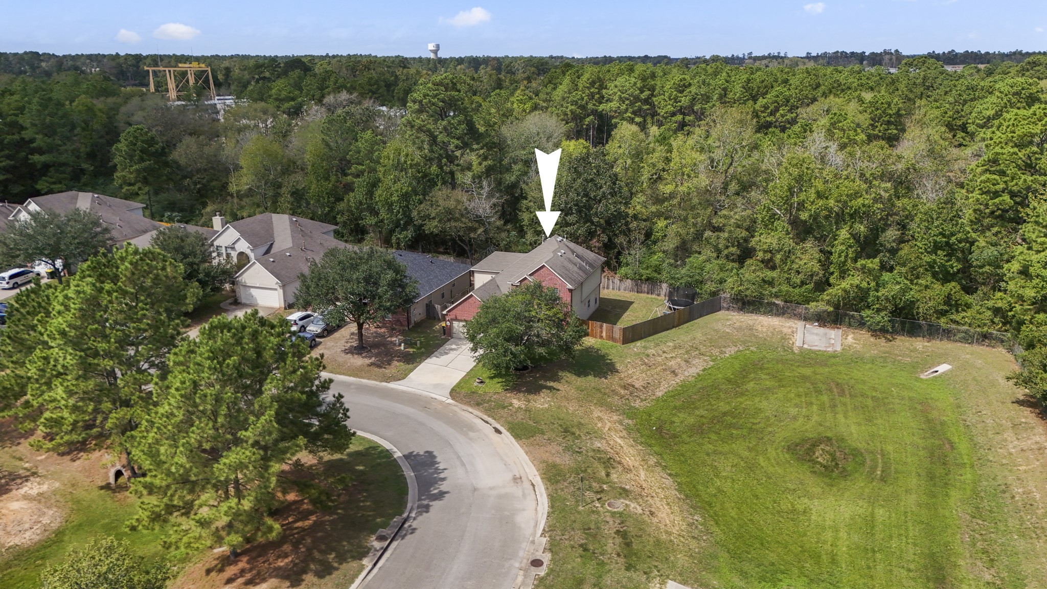 From above, you can really see what makes this homesite differentno back neighbor, no neighbor on the right side, and no home directly across the street. That extra breathing room gives the property a more open feel from every angle, with mature trees and green space surrounding much of the view.