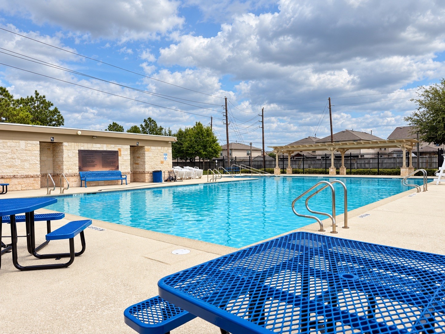 Community Pool | Gated Swimming Pool with Covered Seating Areas