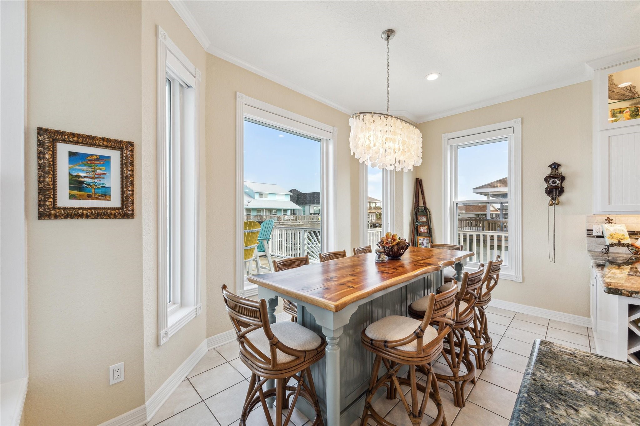 The breakfast room is centered around the custom built cedar wood top table which offers additional storage below. This table stays with the home!