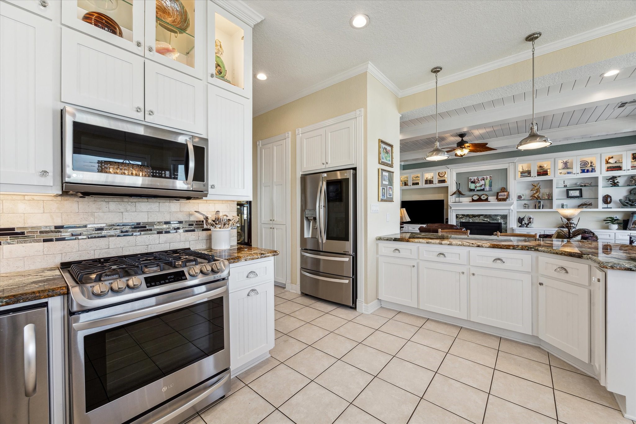 To every chef's delight there is a gas range! Next to the refrigerator is a custom designed pantry and around the corner is the laundry room and office/4th bedroom.