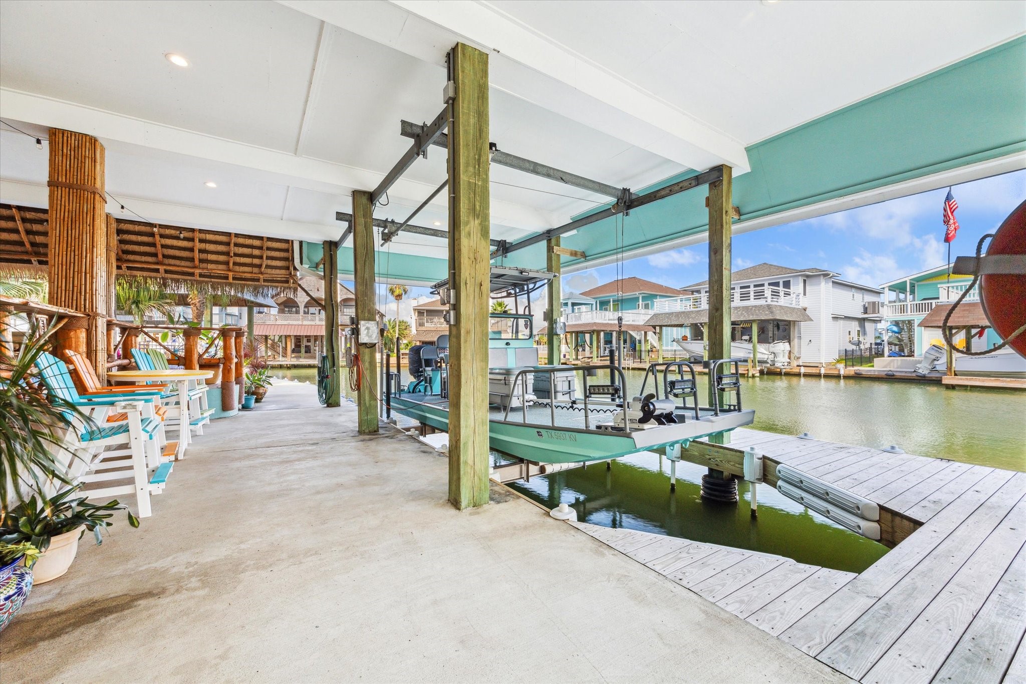 This is one of the two boat slip with bumpers and lift. It can easily accommodate this 22 foot boat with plenty of room for a larger boat! You can also sit and enjoy the water views down here because the decking above was sealed and finished with Hardie Board.
