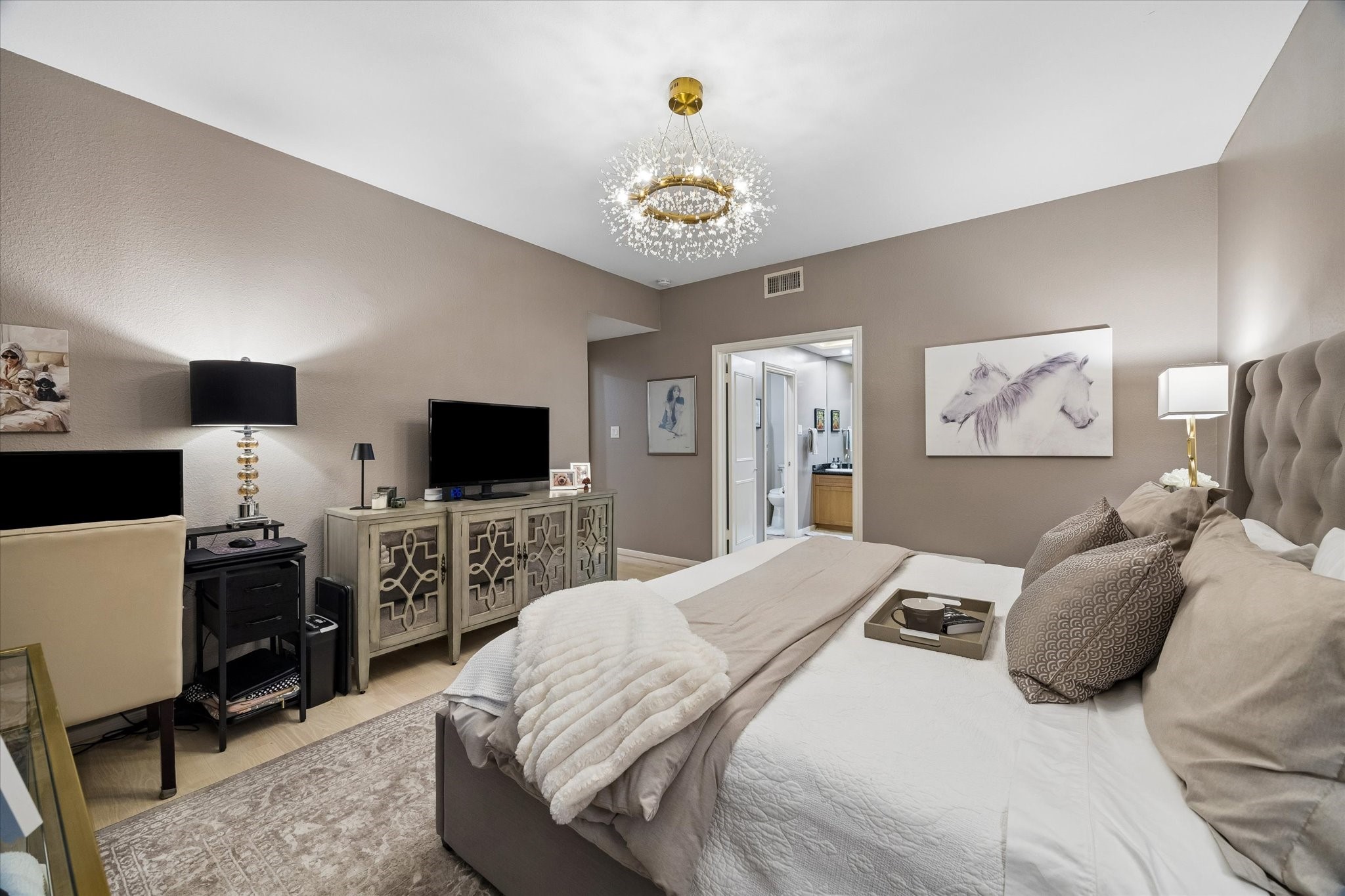 Another view of primary bedroom with designer paint