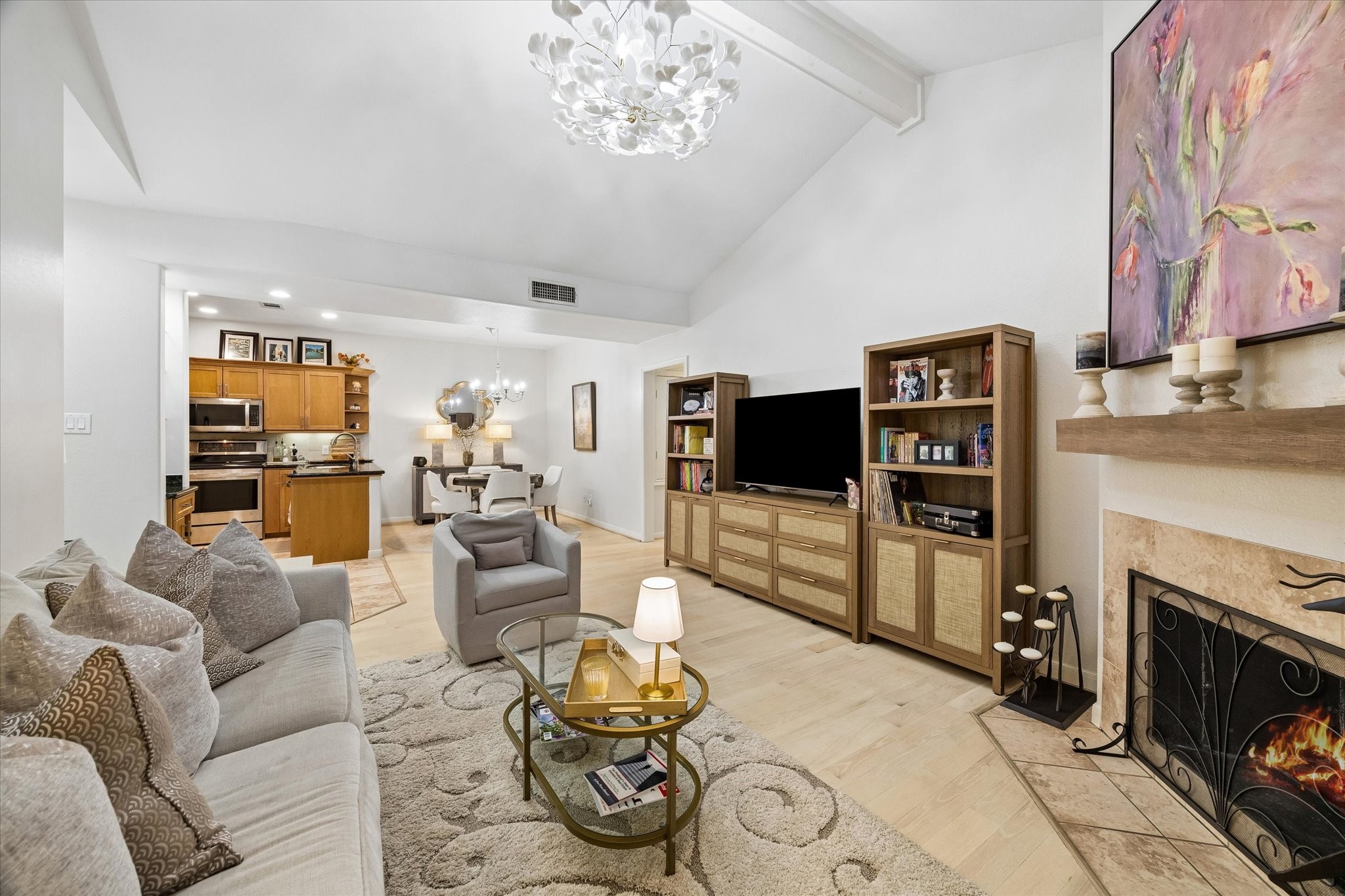 Open concept living with high ceilings, fireplace - light and bright
