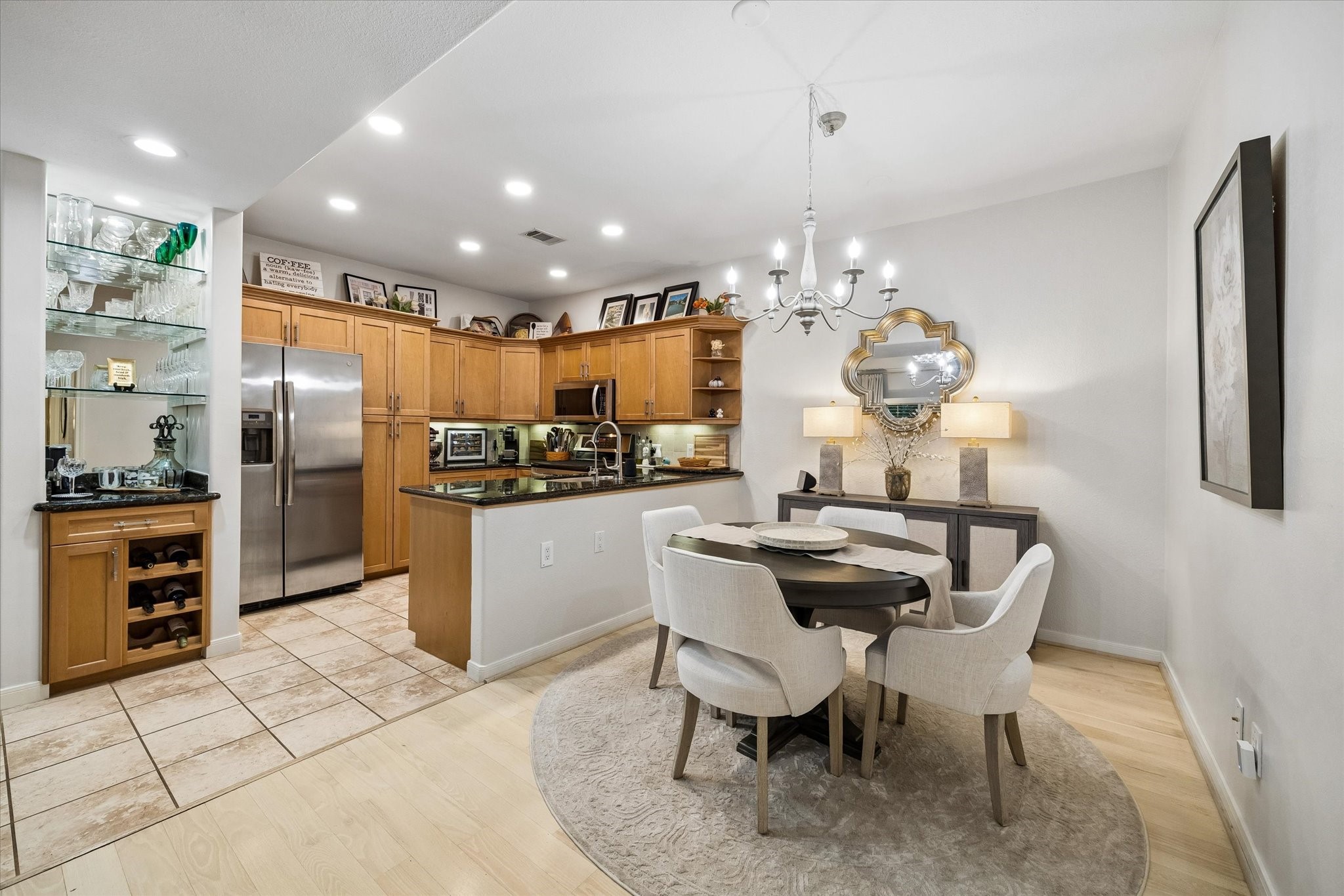 Dining room and open kitchen with bar area Dining room and open kitchen with bar area