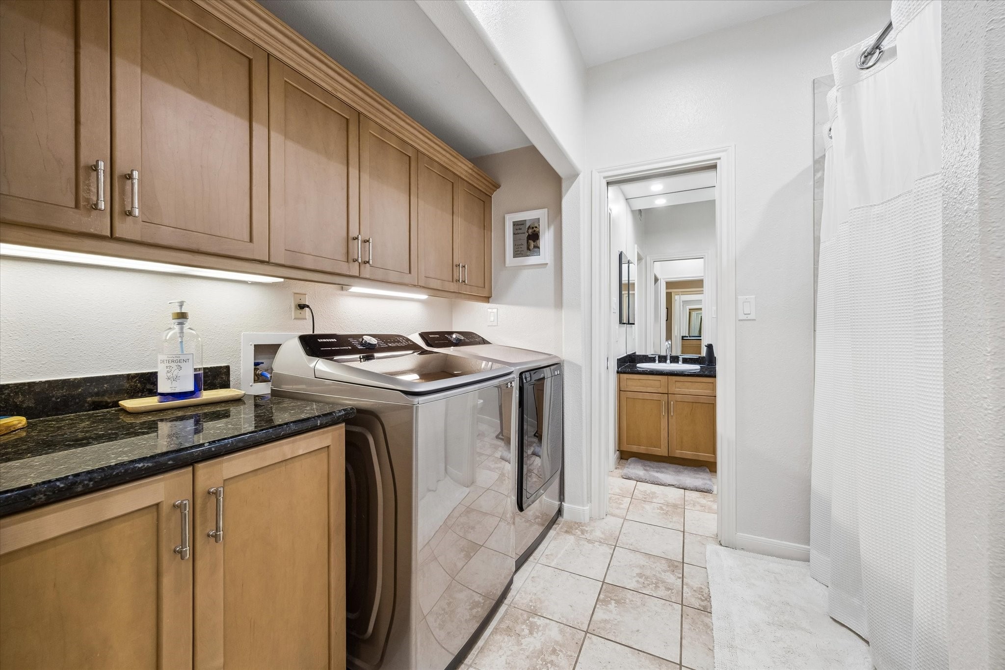 Fabulous laundry area with great storage and under cabinet lighting