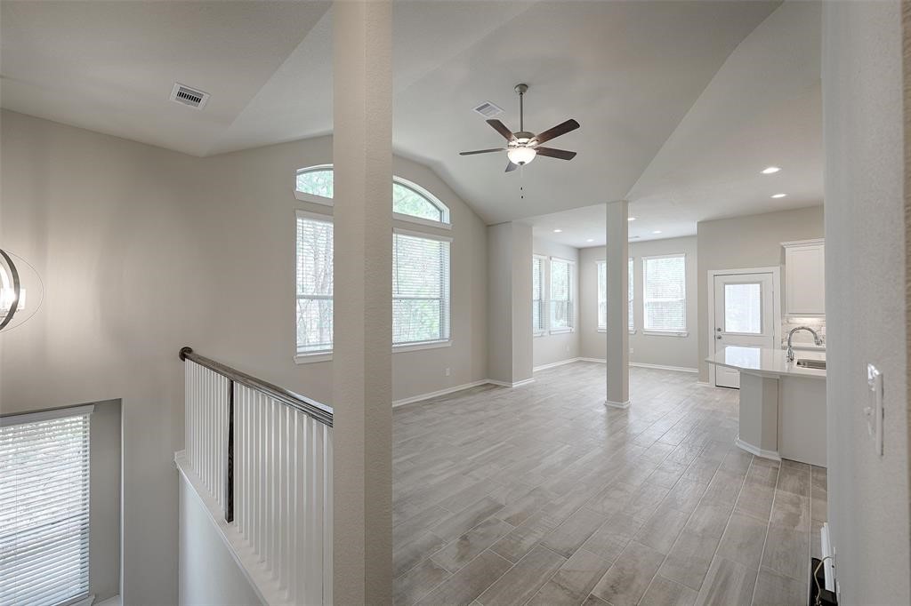 High ceilings. Walls of windows. Wood look tile floors.