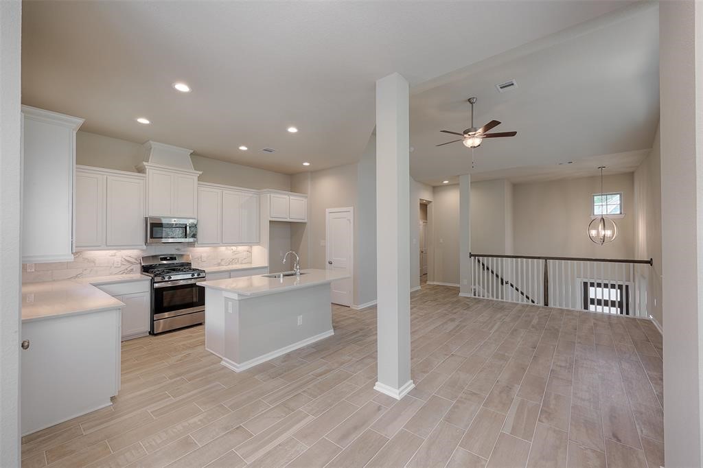 Loads of cabinets and large pantry. Gas range, microwave, and dishwasher included.