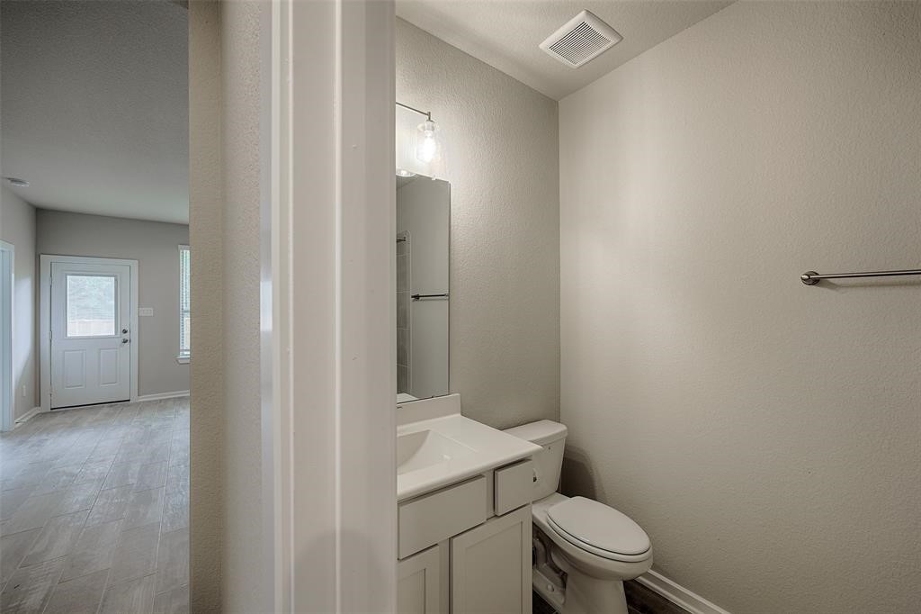 Ground level bath off large flex living area.