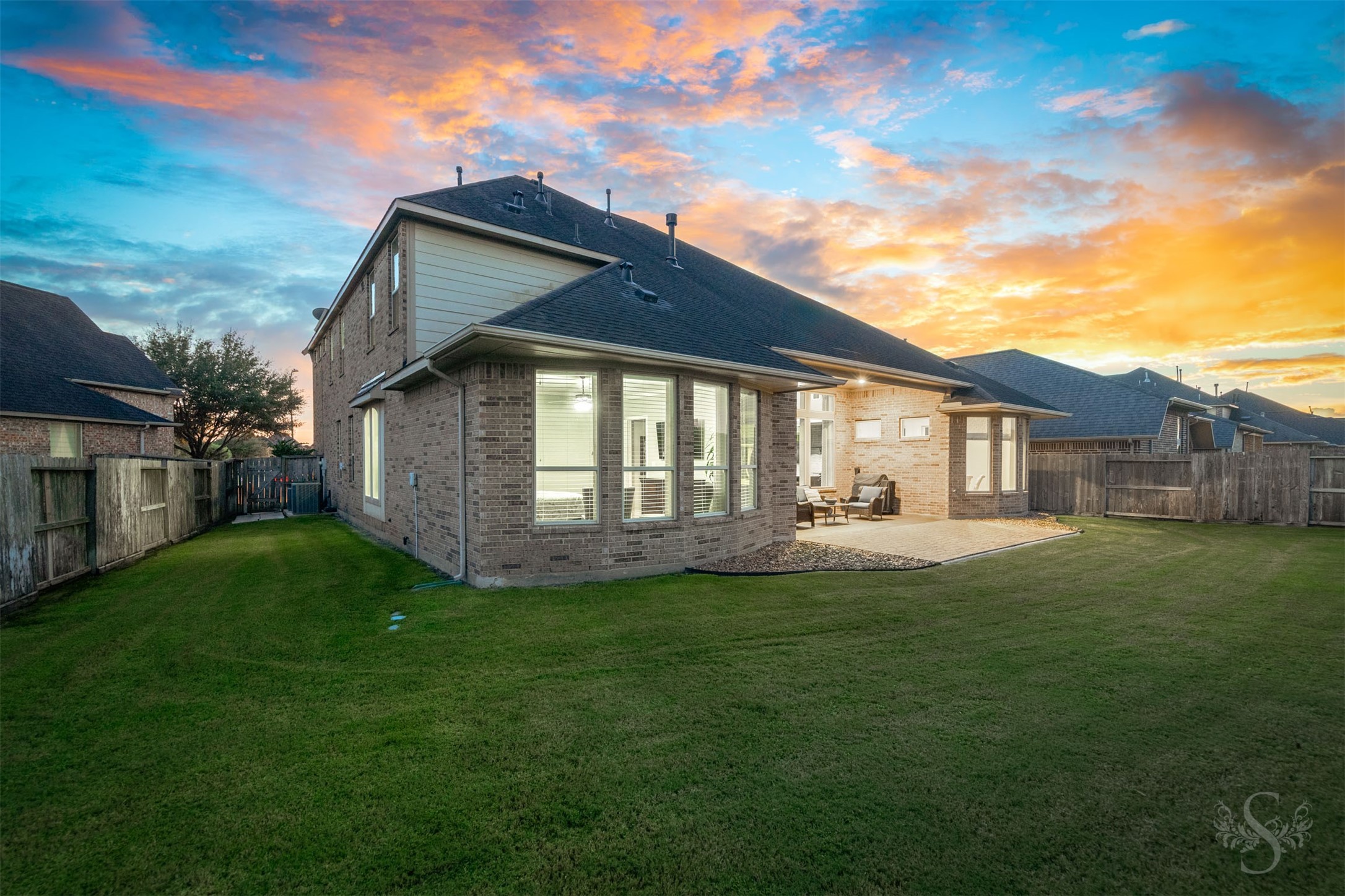 An expansive lawn wraps around the home, providing abundant space for outdoor games, gardening and family fun. The covered patio and adjoining paver extension offer a welcoming setting for relaxed evenings and weekend entertaining.